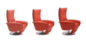 Three modern red swivel chairs in a row on white background.